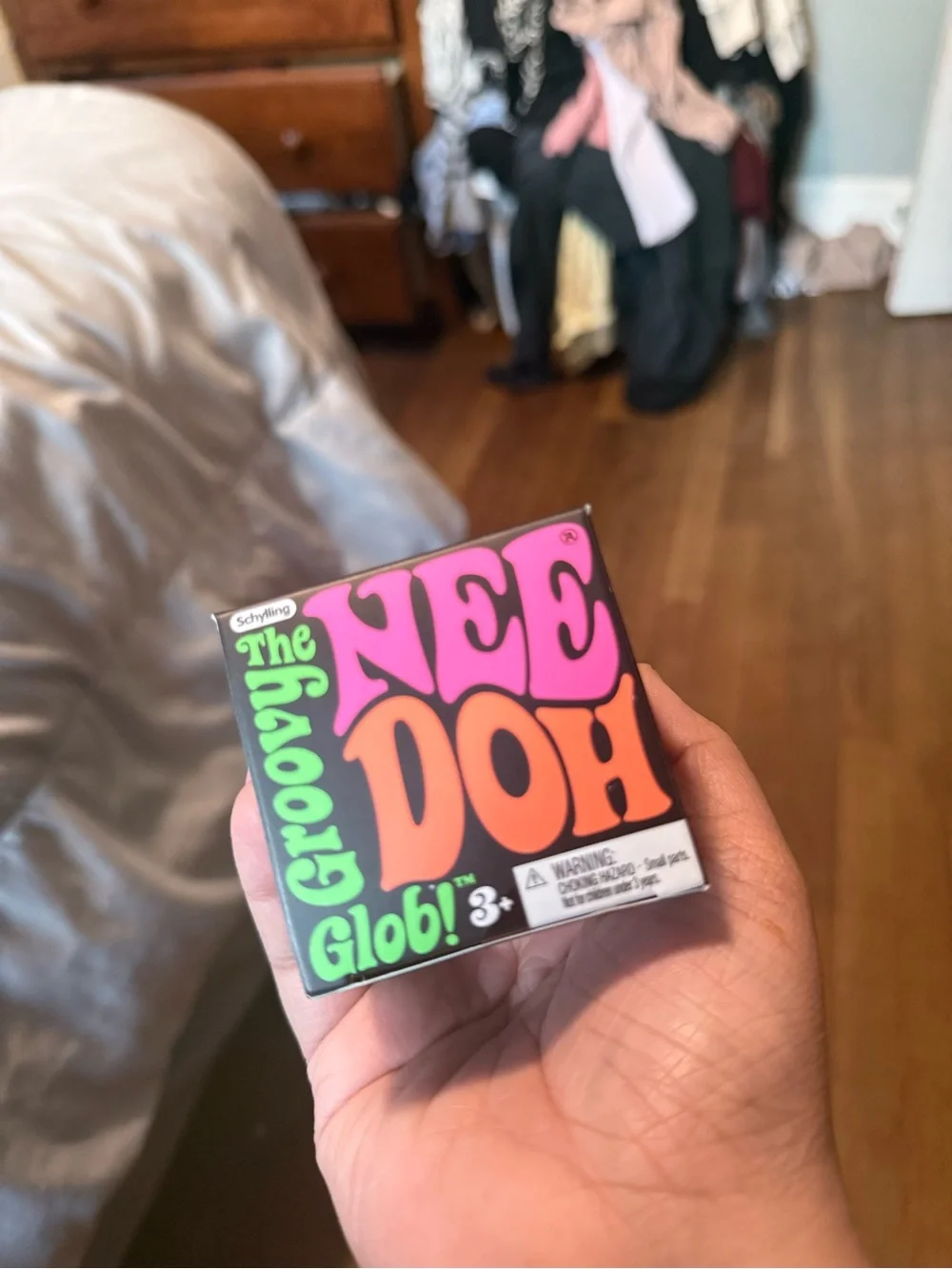 The Nee Doh Groovy Globi Stress Ball - Bright Pink & Orange Packaging